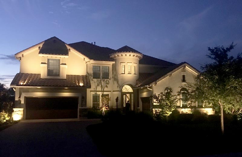 Outdoor lighting lights up a home.