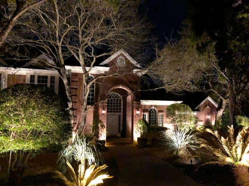 outdoor lighting on a pathway leading to a front door