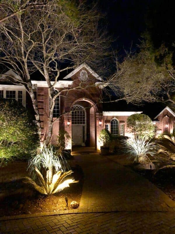 outdoor lighting on a pathway leading to a front door
