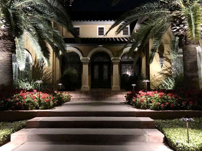 A beautiful shot of a front of a home with immaculate outdoor lighting.