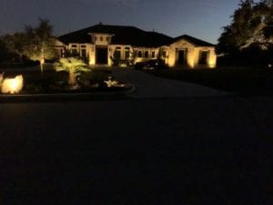 outdoor lighting shining on a home