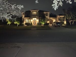 outdoor lighting shining on a home