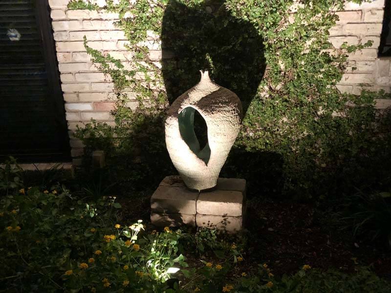 garden lighting shining on a statue