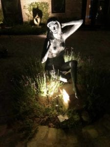 garden lighting shining on a woman statue