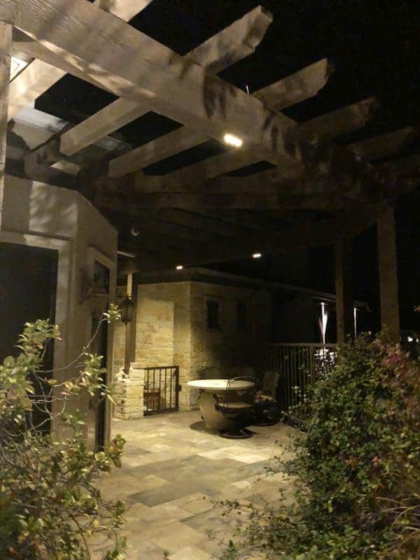 Outdoor Kitchen and Patio Lighting with a table.