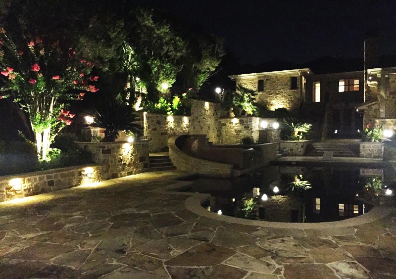 outdoor lighting around a pool and on stairs