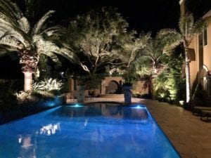 poolside lighting and landscape lighting in a beautiful backyard
