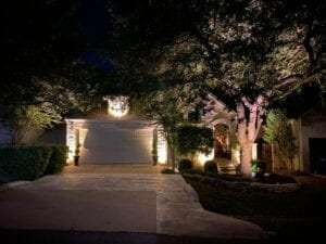landscape lighting of a small brick home