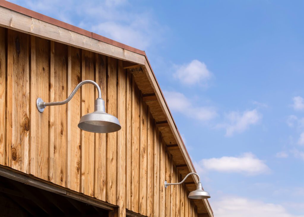 Gooseneck lights on a barn wall